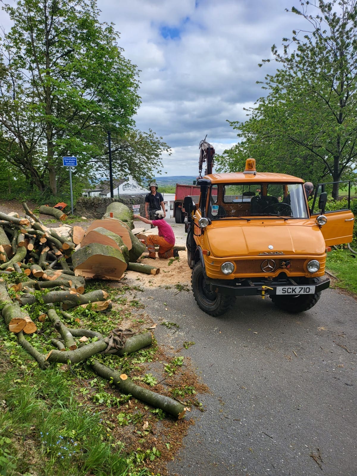 Unimog with timber crane providing tree services in rochdale for ACC Tree Care