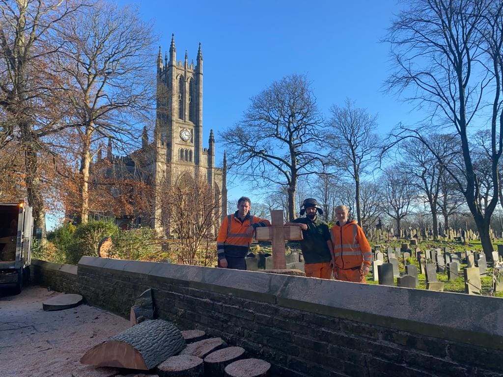 Tree Carving into Cross after Tree Removal over Headstones at Cathederal in Rochdale by ACC Tree Care1